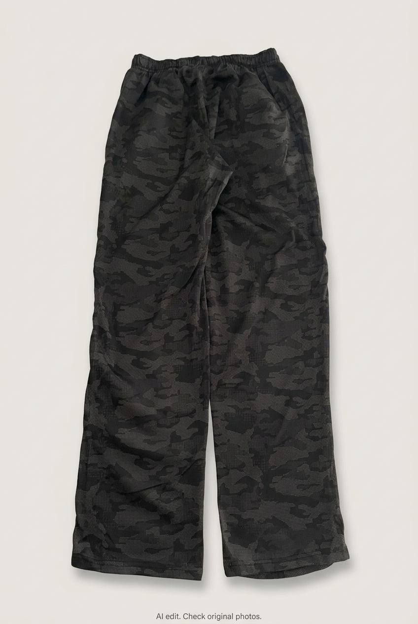 Back product view of black camouflage track pants, flat lay