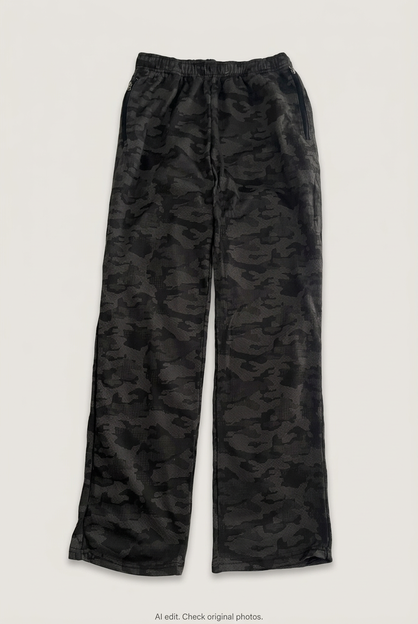 Front product view of black camouflage track pants, flat lay