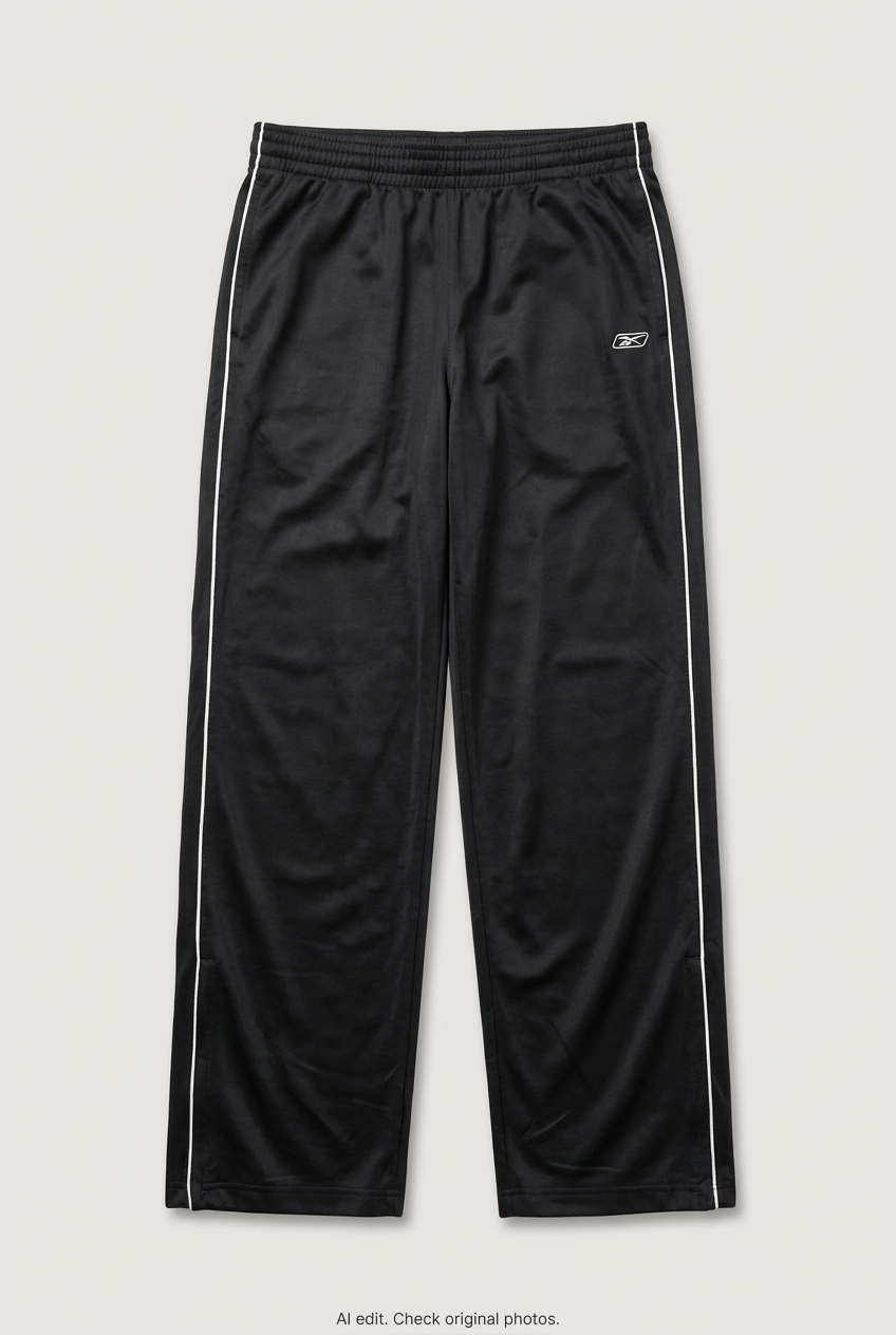 Front product view of black Reebok track pants, flat lay