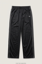 Front product view of black Reebok track pants, flat lay