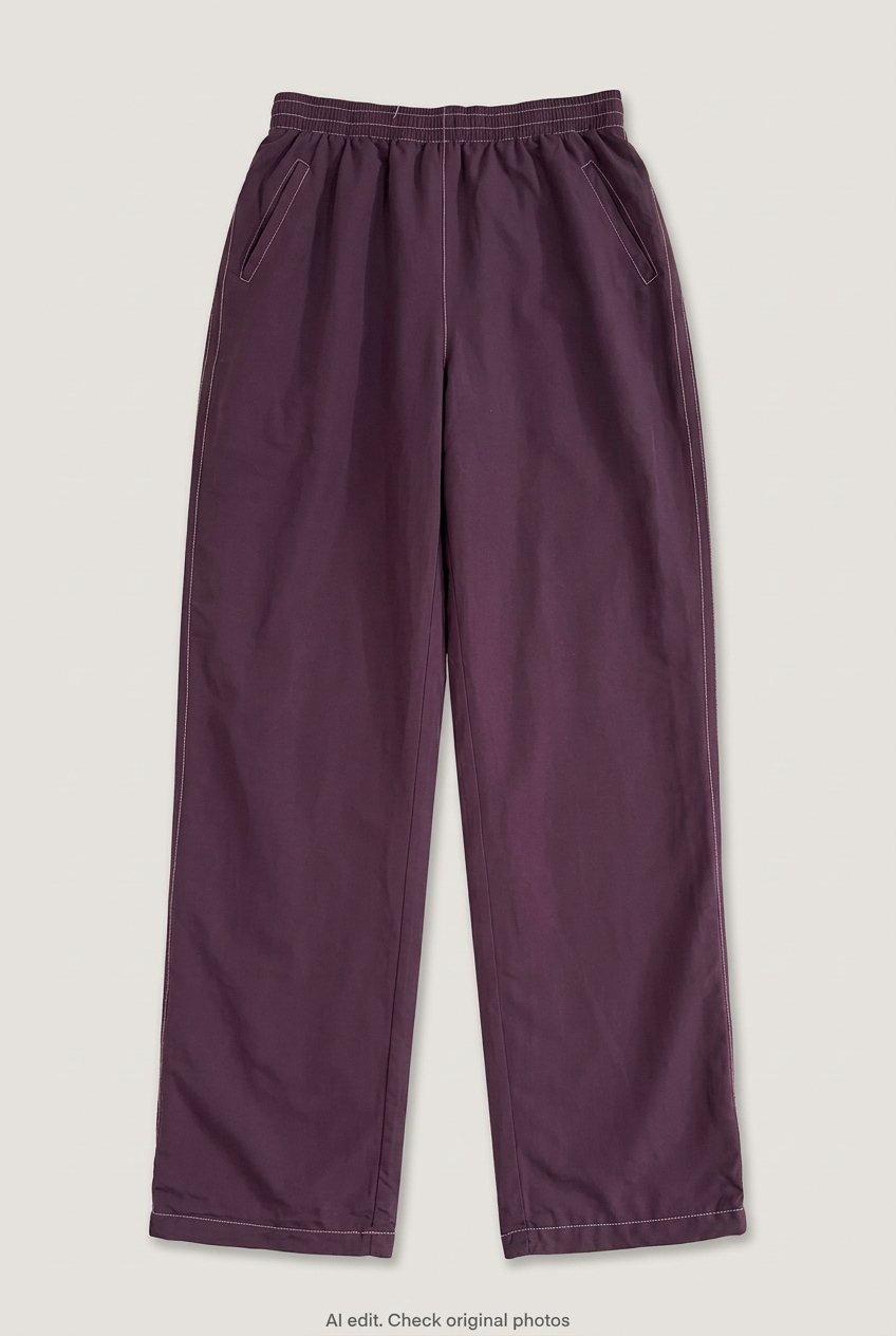 Front product view of maroon track pants, flat lay